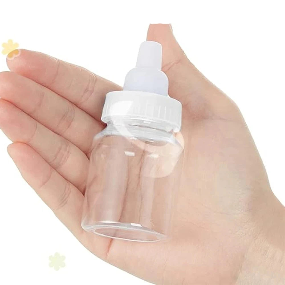 Clear plastic bottle with white cap held in a hand on a white background