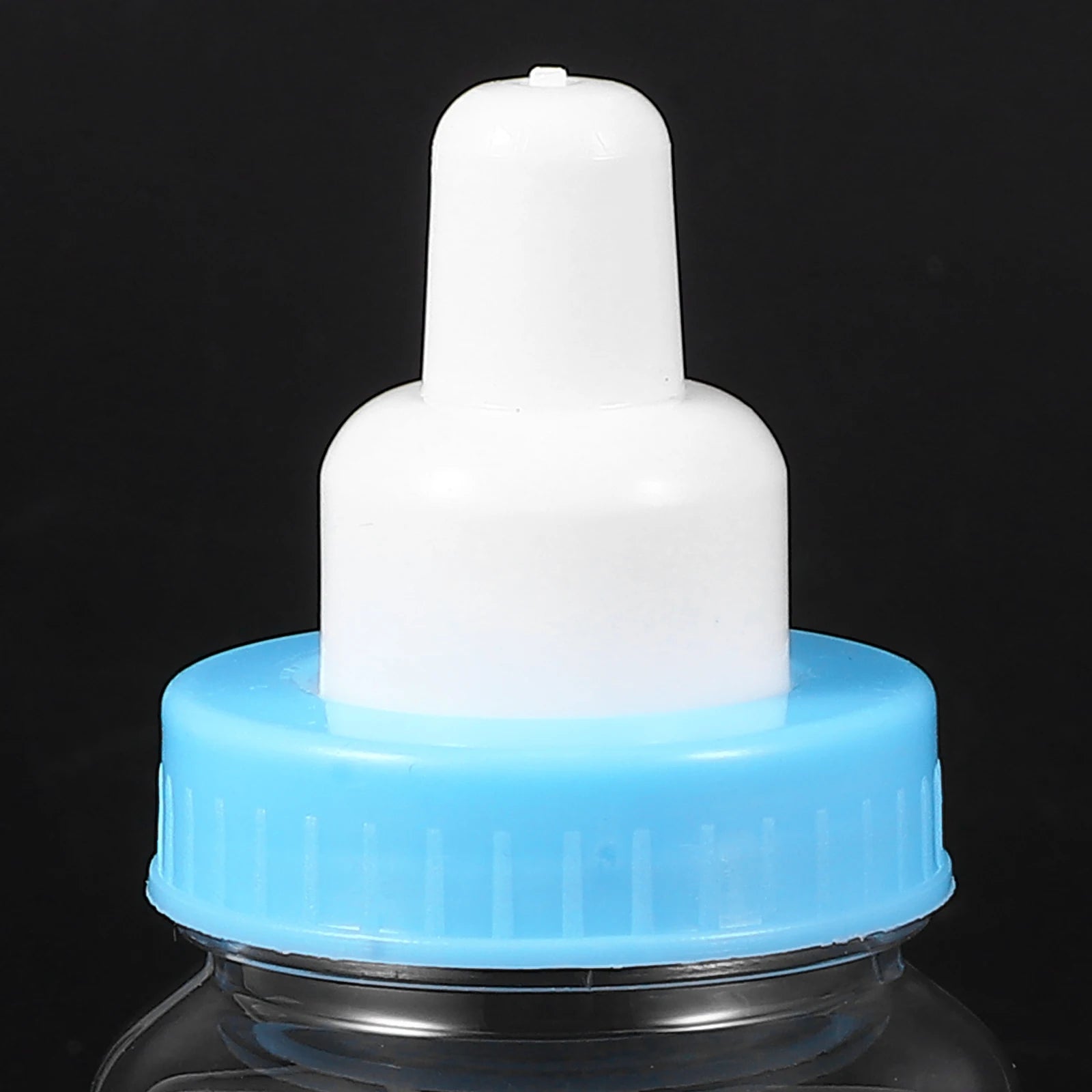 White bottle cap with blue base on a black background