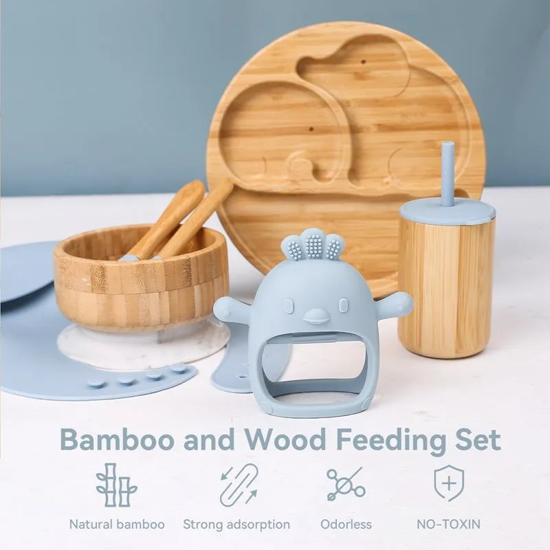 Bamboo and wood feeding set with a blue silicone teether on a light gray background
