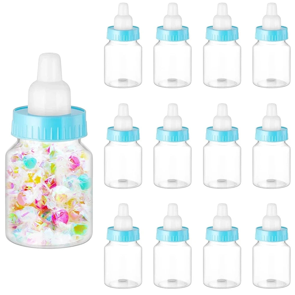Clear baby bottles with blue lids and colorful contents on a white background