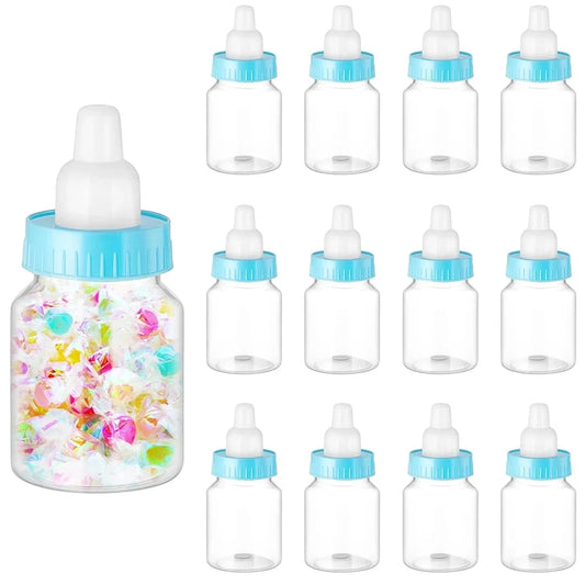 Clear baby bottles with blue lids and colorful contents on a white background