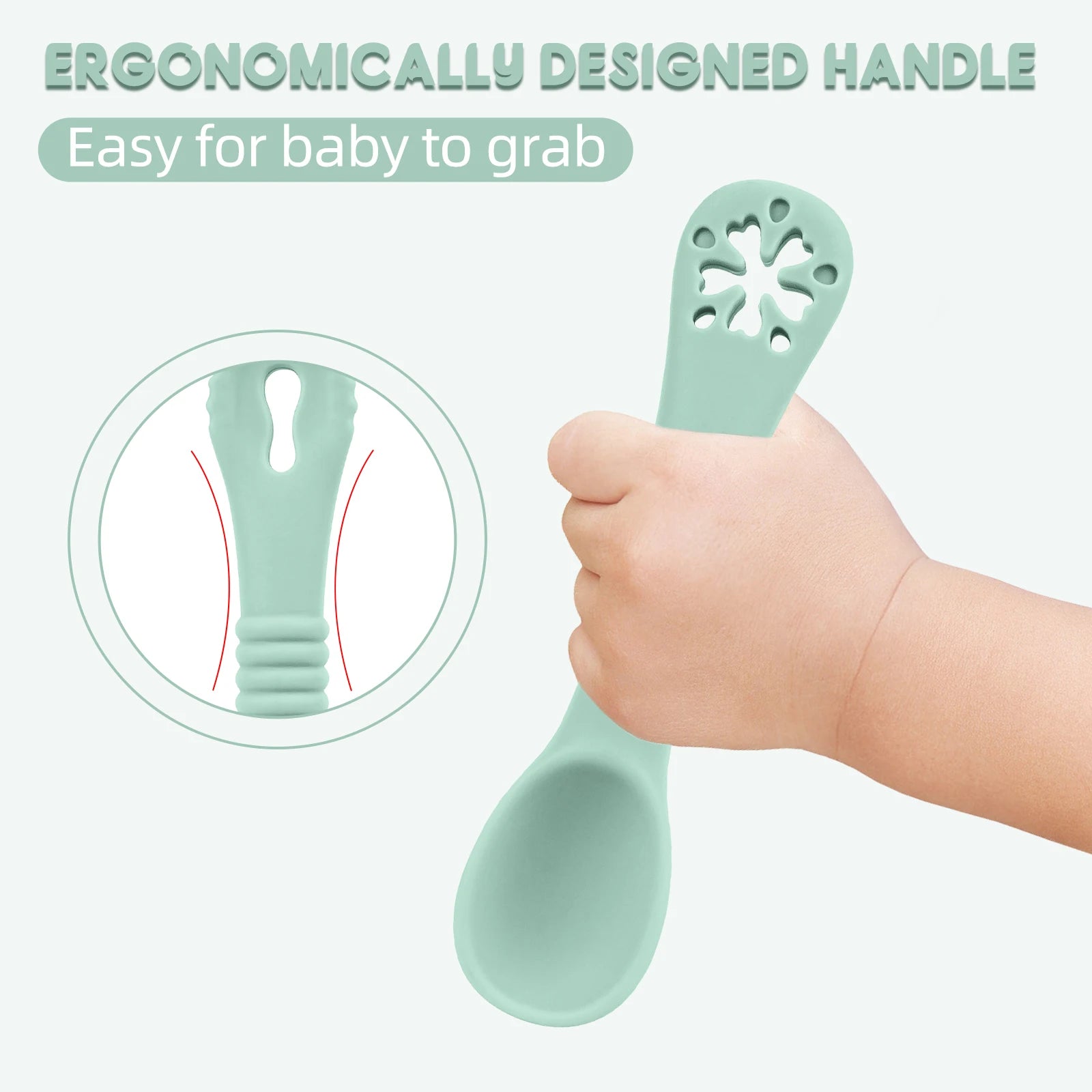 Mint green spoon with ergonomic handle held by a hand, on a light gray background.