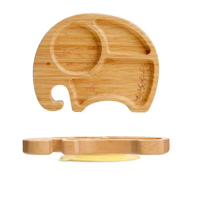Wooden elephant-shaped tray with a small yellow dish on a white background