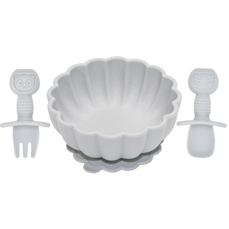 White bowl with two安抚器 (soothing toys) on a white background