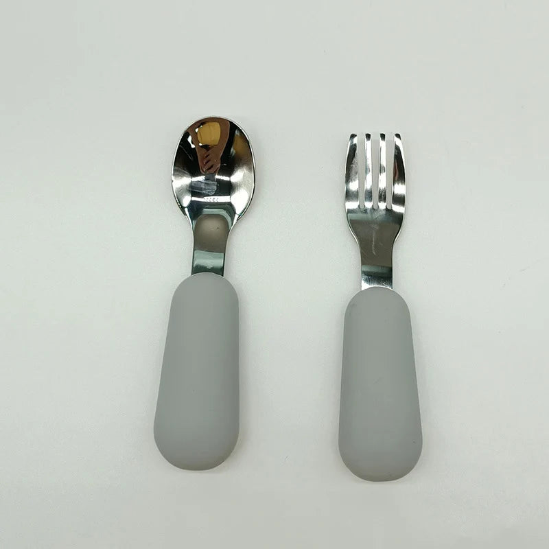 Spoon and fork set with gray handles on a white background