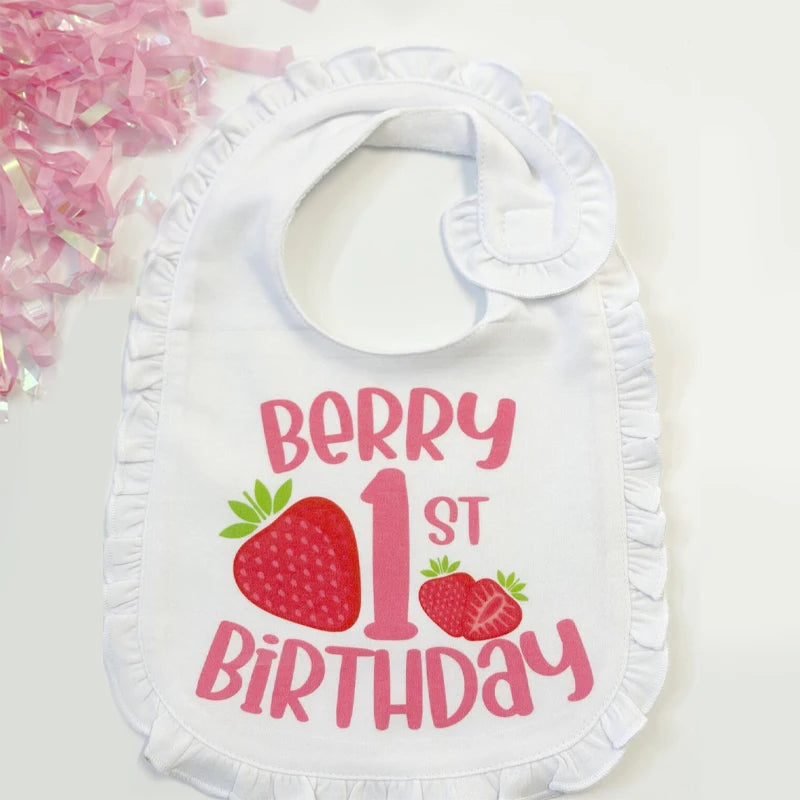 White bib with 'Berry 1st Birthday' text and strawberry graphics on a white background.
