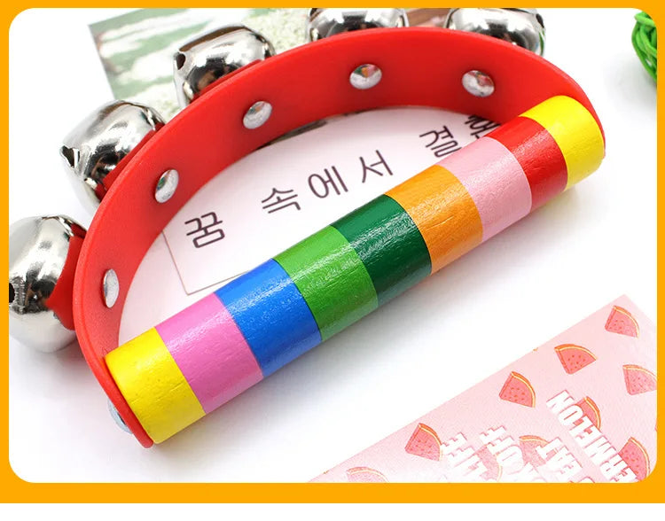 Colorful handbell with a multicolored handle on a white background