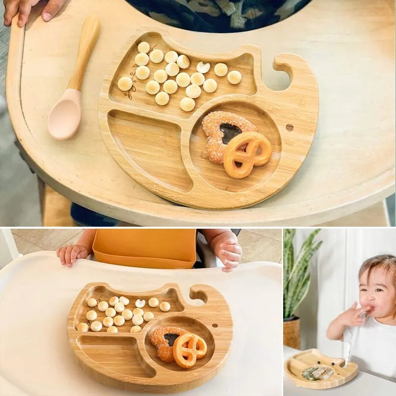 Wooden tray with compartments containing food, used by a child, on a high chair.