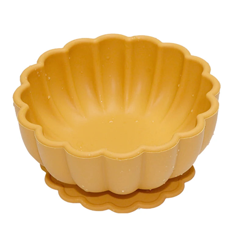 Yellow scalloped-edge bowl on a white background