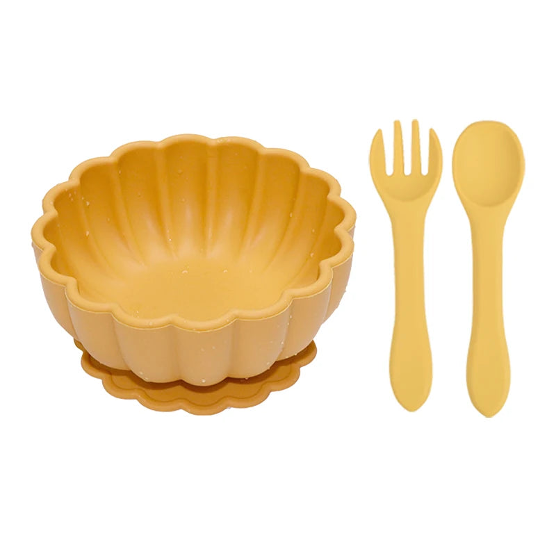 Yellow bowl with matching fork and spoon on a white background
