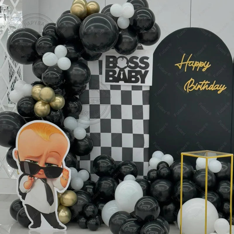 Balloon arch with 'BOSS BABY' theme and 'Happy Birthday' sign.