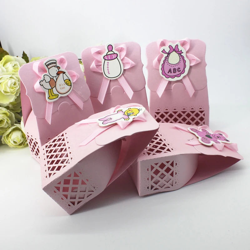 Pink decorative boxes with cartoon characters and ribbons on a white background