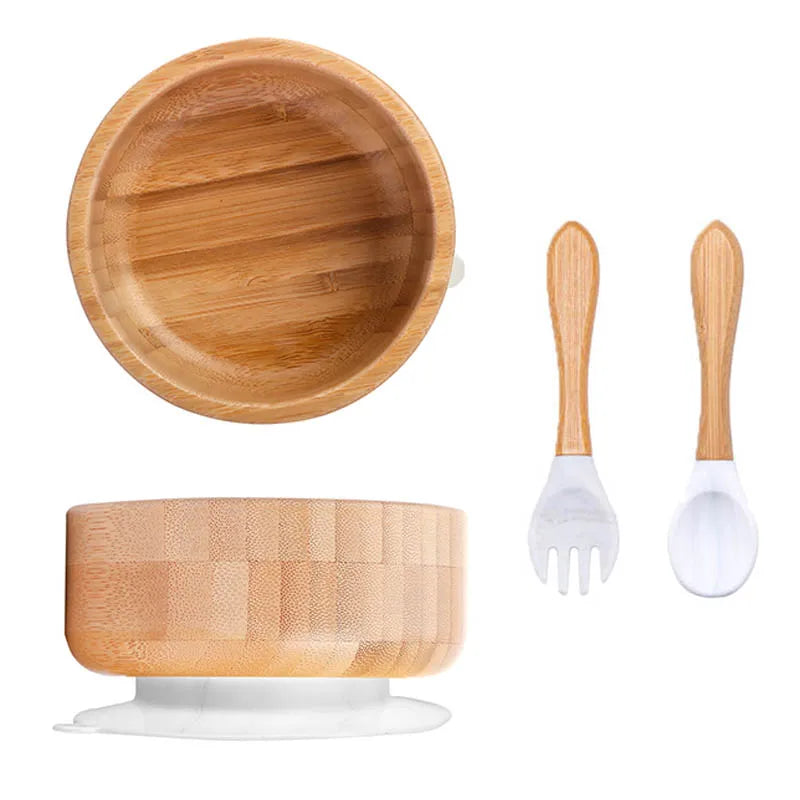 Bamboo bowl set with fork and spoon on a white background