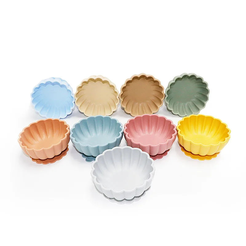 Set of colorful mini tart tins on a white background