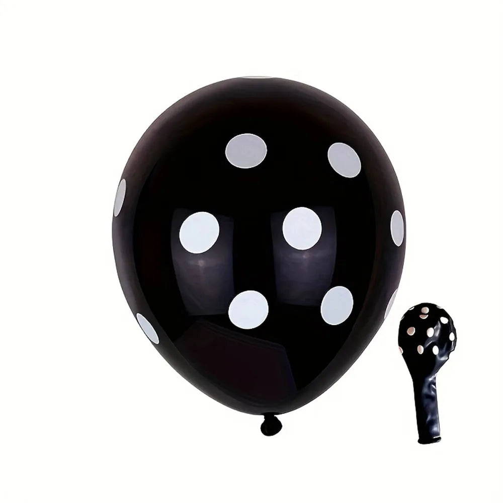 Black balloon with white polka dots and a black pump on a white background
