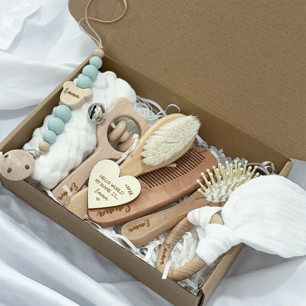 Baby care product set with wooden items in a box on a white background