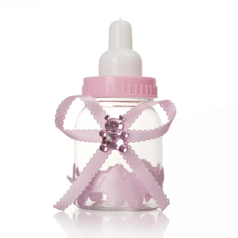 Pink baby bottle-shaped container with decorative elements on a white background