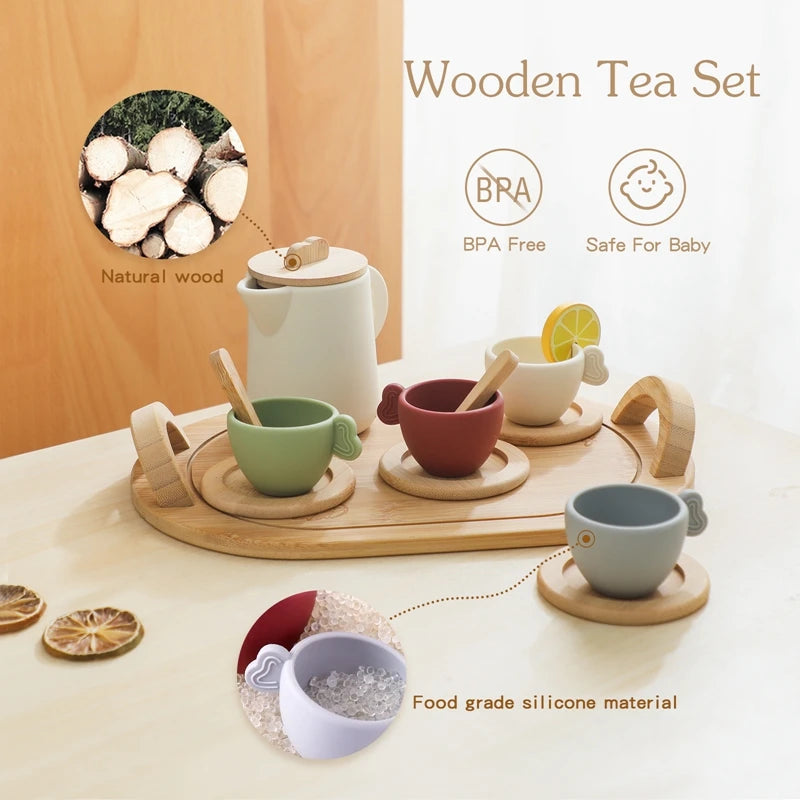 Wooden tea set with cups and a teapot on a light surface, featuring natural wood and BPA-free materials.