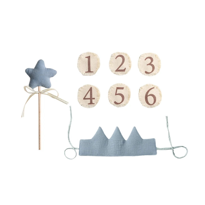 Set of blue star wand, number cards, and blue crown on a white background