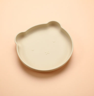 Beige ceramic dish on a peach background