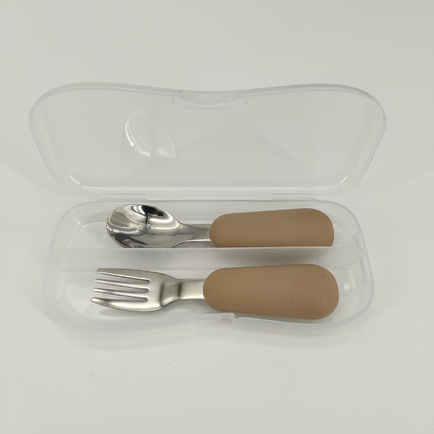 Set of silver fork and spoon with brown handles in a clear plastic case on a white background