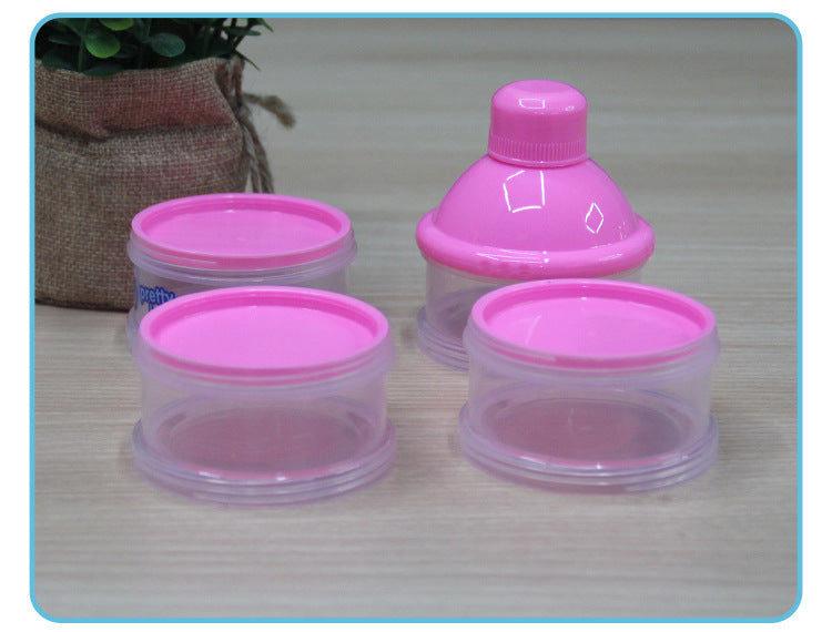 Set of pink and clear plastic containers on a wooden surface
