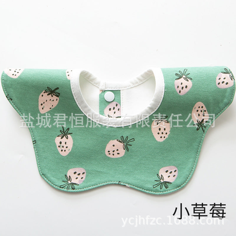 Green bib with strawberry pattern on a white background