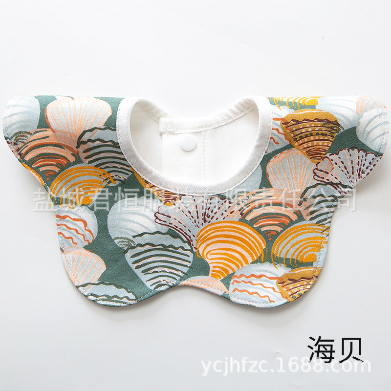 Baby bib with shell pattern on a white background