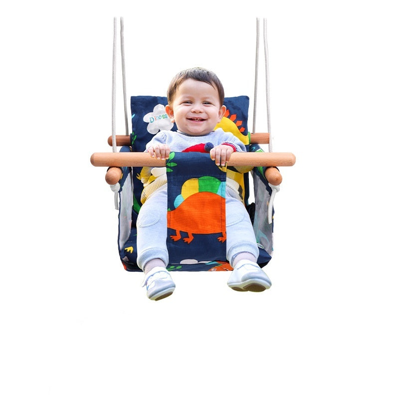 Child sitting in a colorful baby swing with a white background