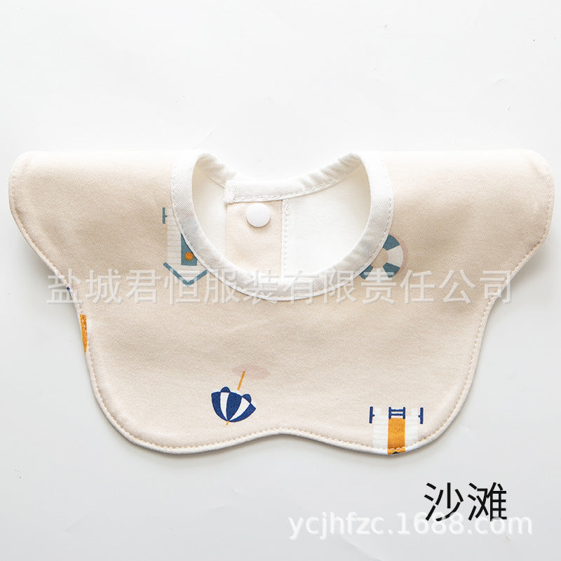 Beige baby bib with blue and orange accents on a white background