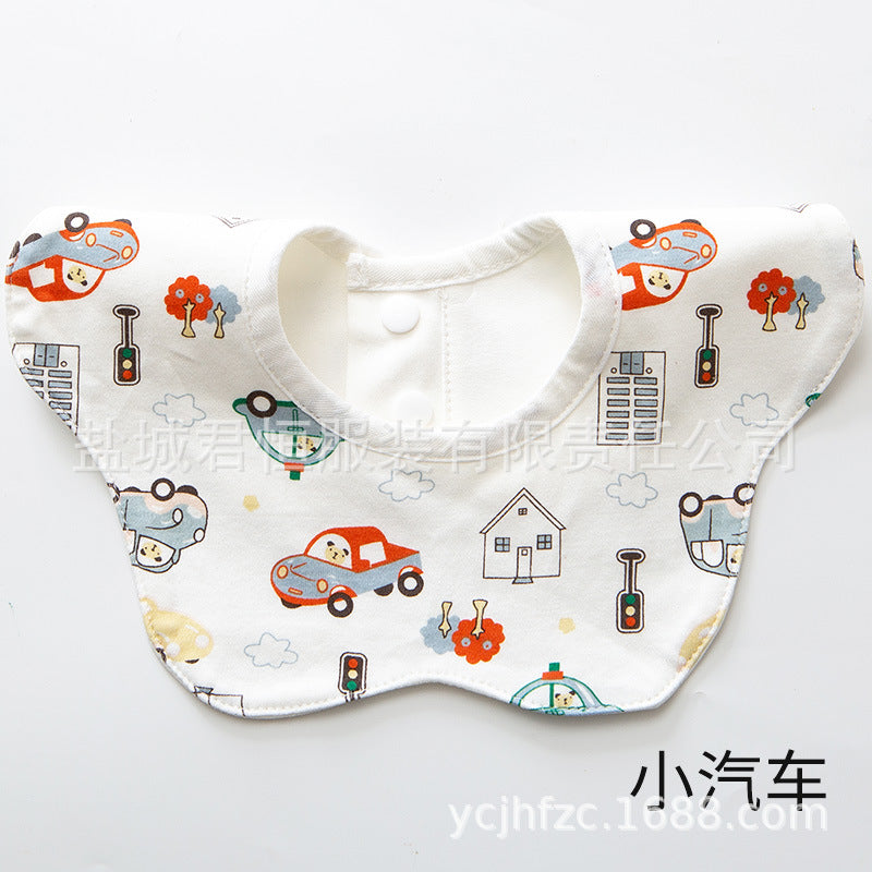 Baby bib with cartoon car and traffic light pattern on a white background
