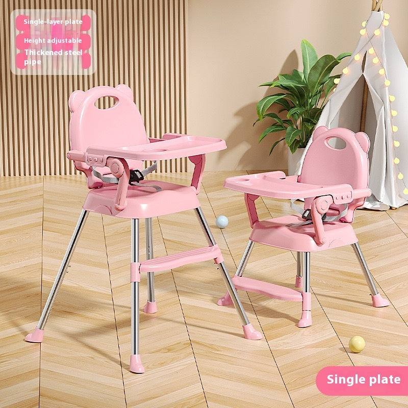 Pink adjustable high chairs on a wooden floor with a plant and teepee in the background.