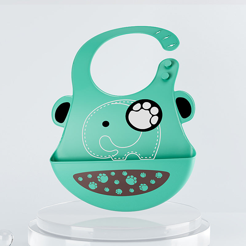 Green silicone bib with elephant design on a clear stand