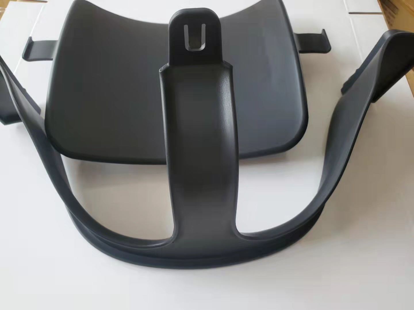Black motorcycle seat on a white background