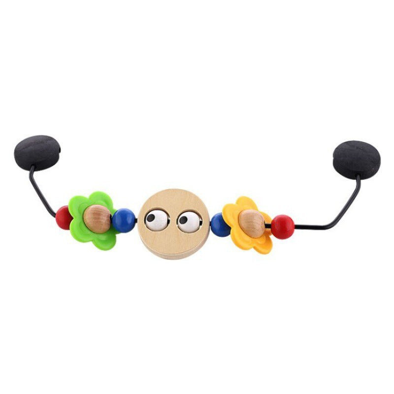 Colorful baby teething toy with flowers and round beads on a white background