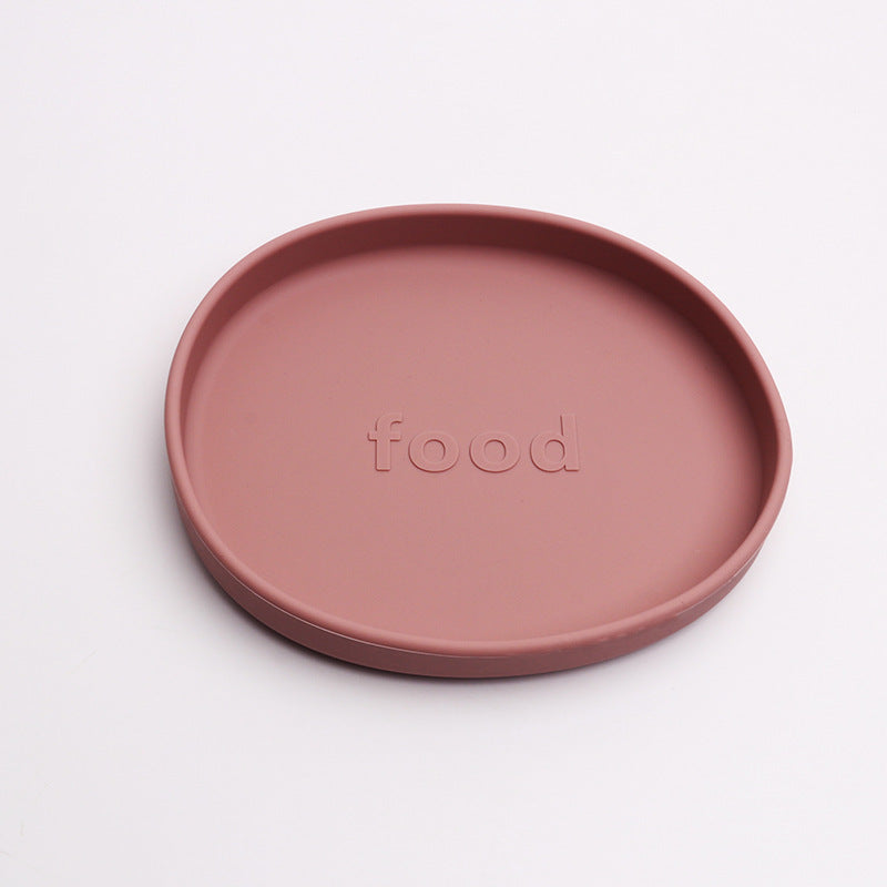 Pink plate with 'food' text on a white background