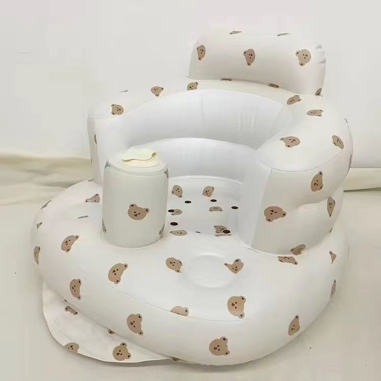 White inflatable baby seat with bear pattern on a white background