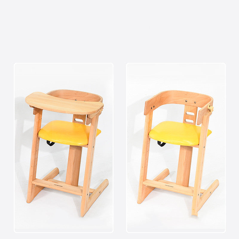 Wooden high chair with yellow seat and backrest on a white background