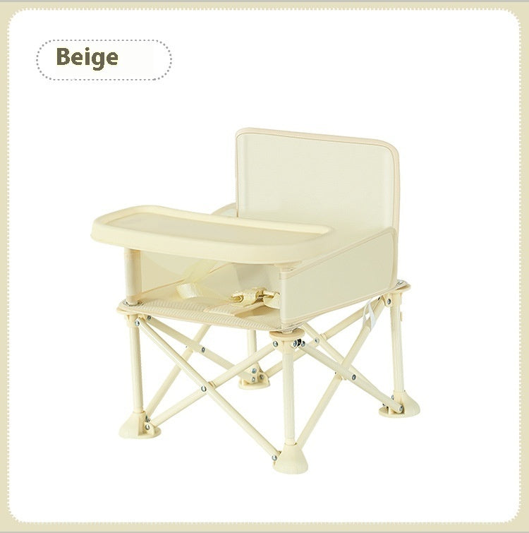 Beige folding chair with a tray on a white background