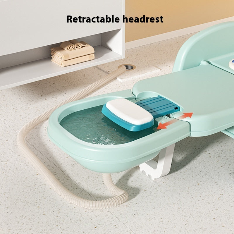 Children's bathtub with a retractable headrest on a light-colored floor.