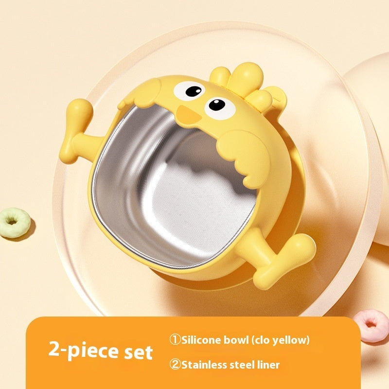 Yellow silicone bowl with stainless steel liner on a beige background