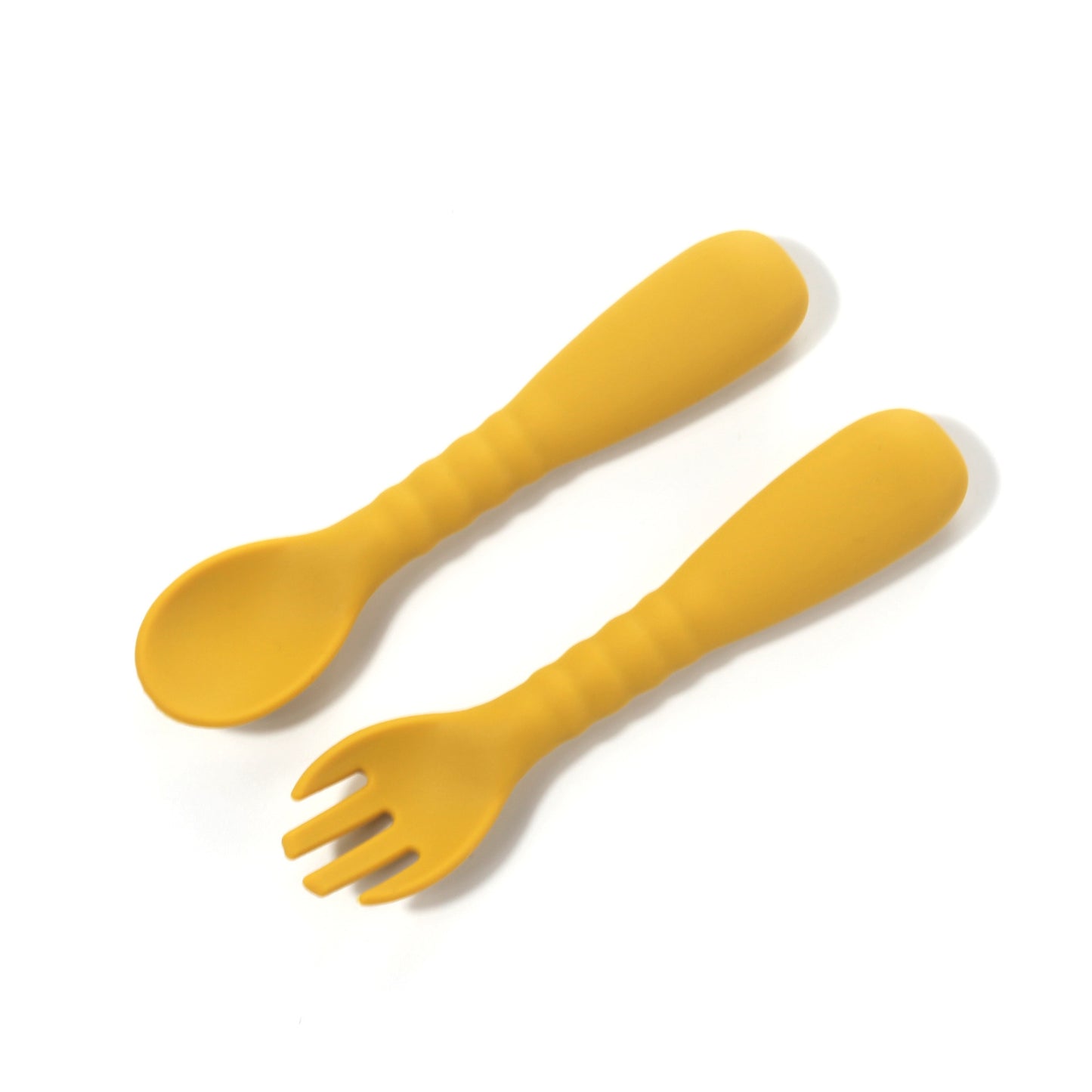 Yellow spoon and fork set on a white background