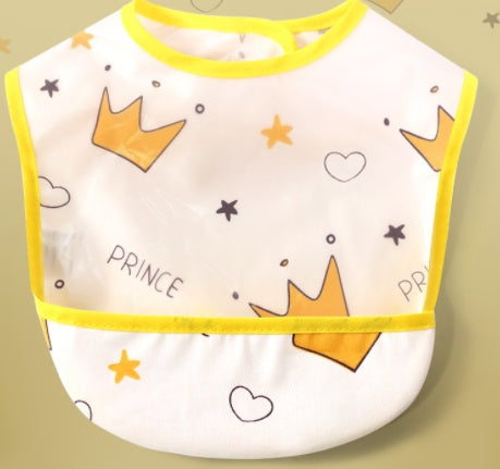 Baby bib with crowns and hearts on a beige background
