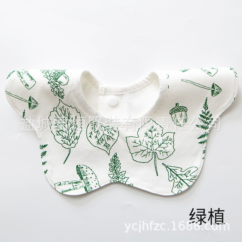 Baby bib with green leaf pattern on a white background