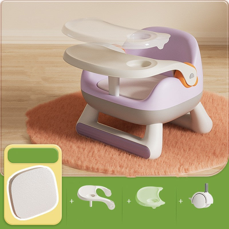 Children's chair with tray and accessories on a wooden floor