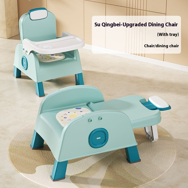 Children's dining chair with tray on a beige floor