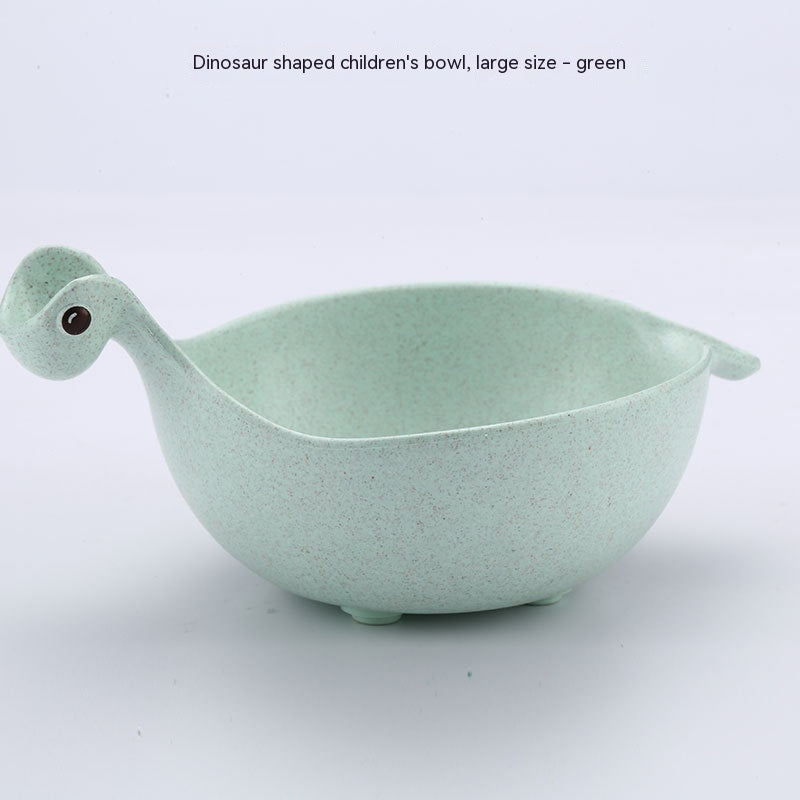 Green dinosaur-shaped children's bowl on a white background