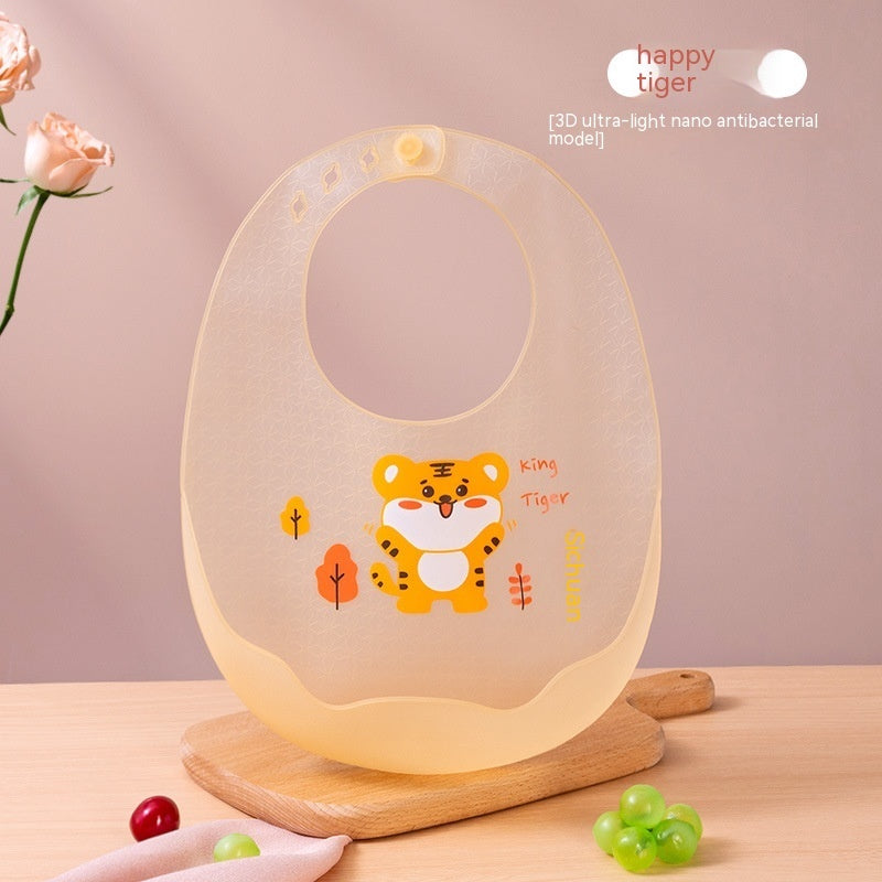 Baby bib with tiger design on a wooden stand against a pink background, featuring 'happy tiger' branding.