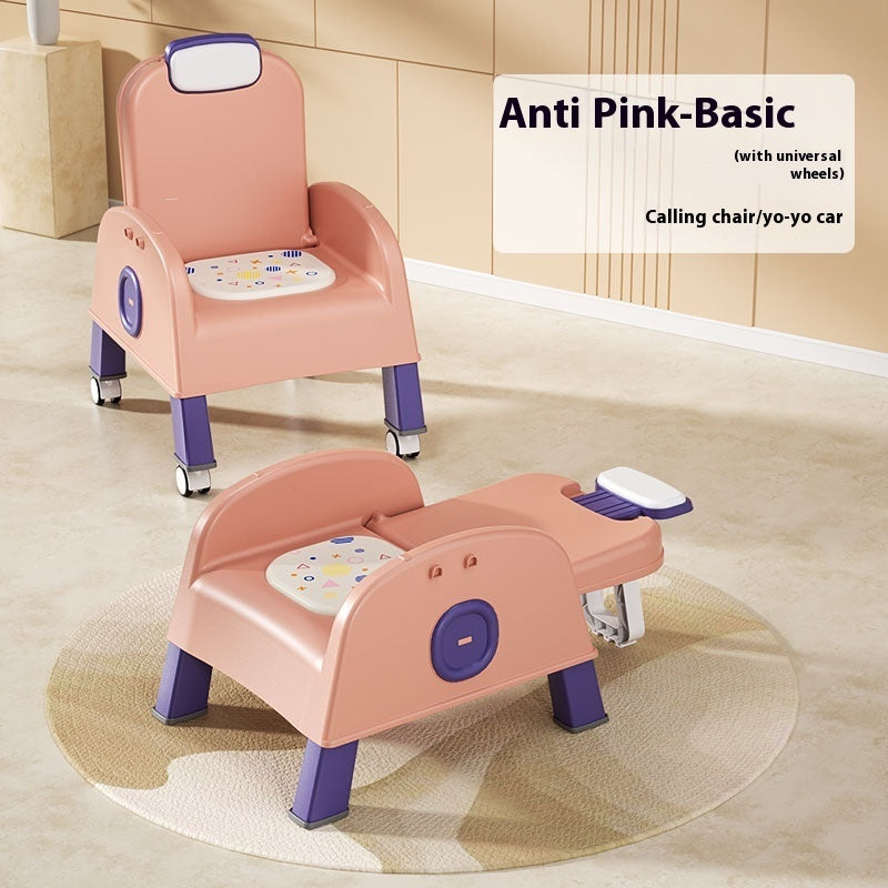 Pink children's chair with wheels on a beige floor.