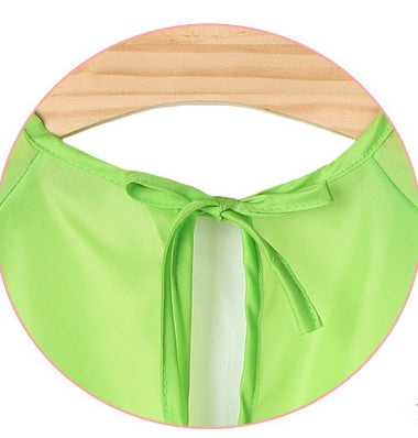 Green bikini bottom with a bow on a white background